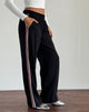Imagen del pantalón Bennett en negro con raya lateral rosa