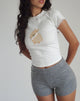Imagen del top Izzy en blanco roto con estampado de conejos