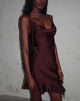 Imagen del minivestido Litera Ruffle en ciruela oscuro con rosetón