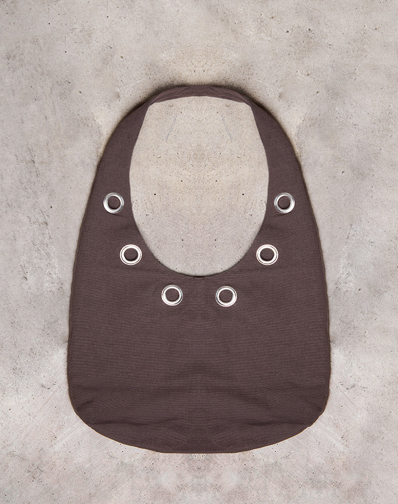 Bolso de hombro Oru en marrón con ojales