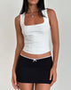 imagen de la minifalda Vadia en negro con ribete de picots blancos y lazo