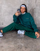 Imagen de sudadera Glo en verde botella con bordado Take Care Of Yourself