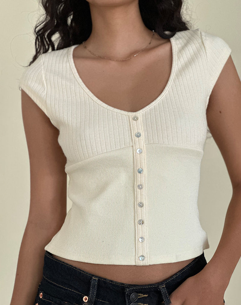 Top con botones Dawira en marfil