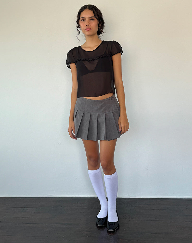 Imagen de la blusa Henrietta de gasa negra con volantes