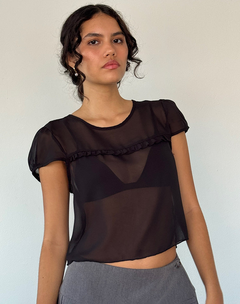 Blusa Henrietta de gasa negra con volantes