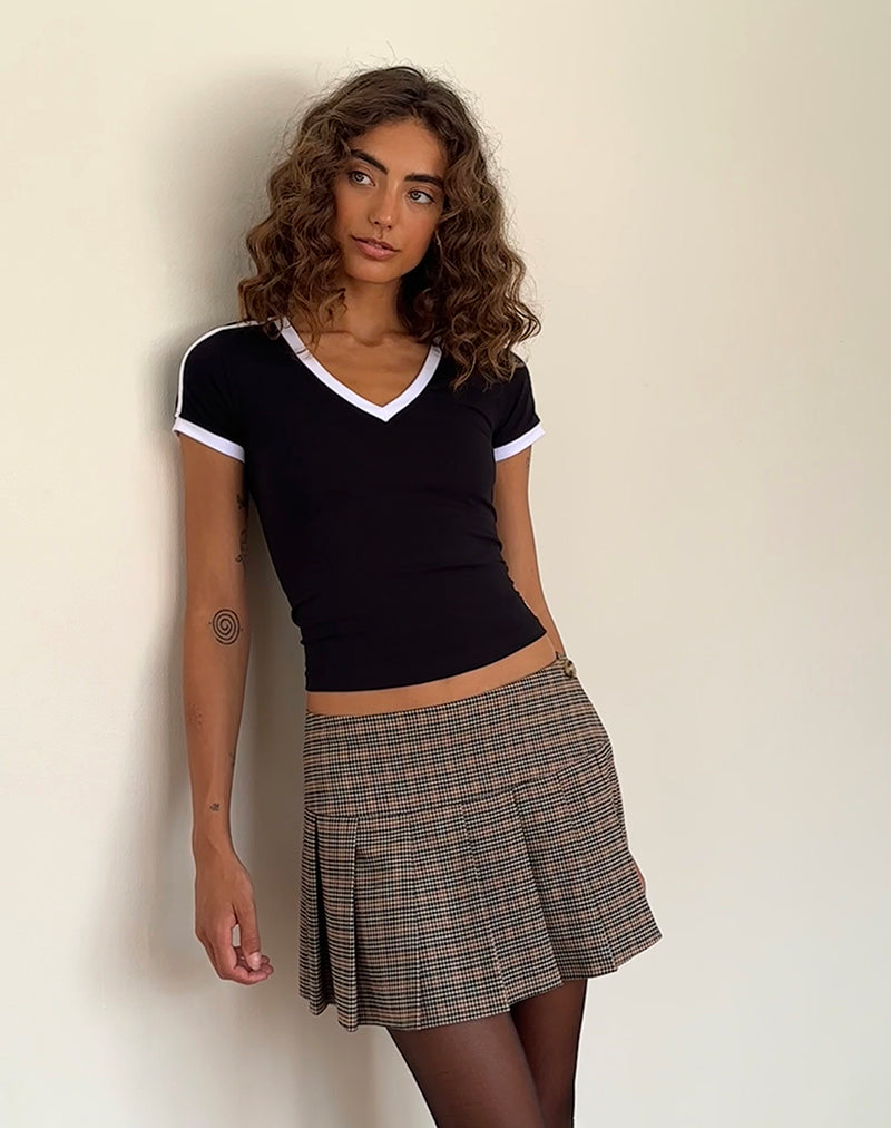 Image of Izolde Camiseta para bebé en negro con ribete blanco y bordado M