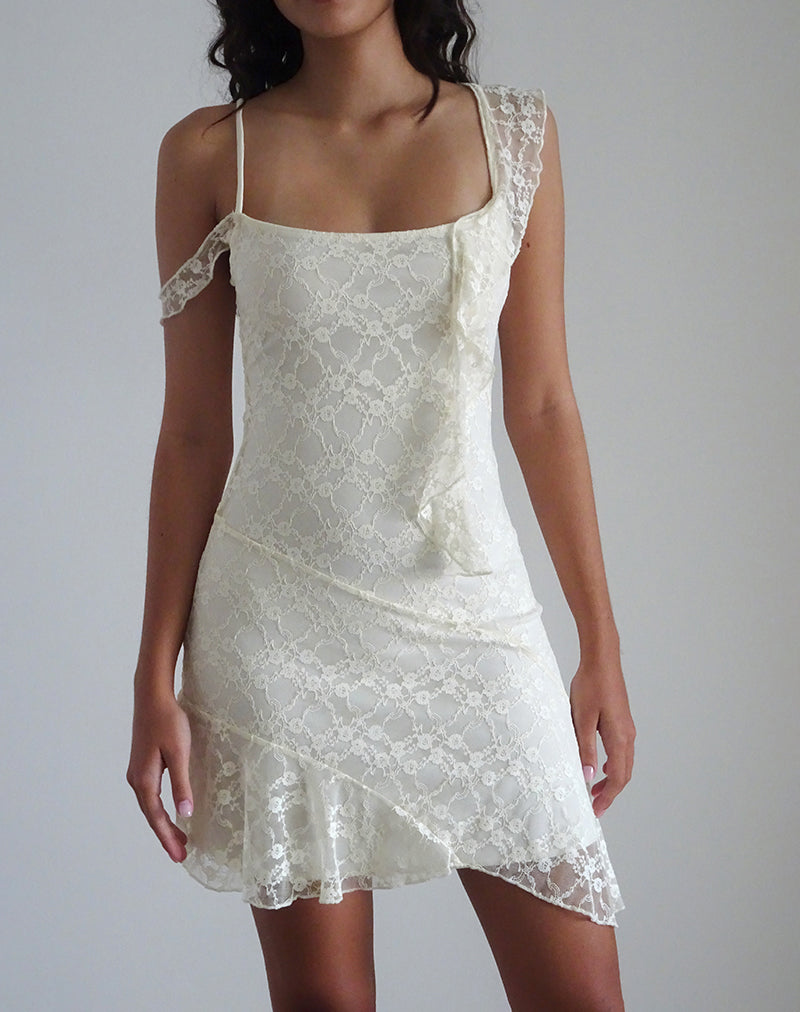 Imagen del minivestido Jati de encaje rosa canina blanco roto