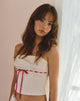 Imagen de Kaita Cami Top en color crema con ribete rojo