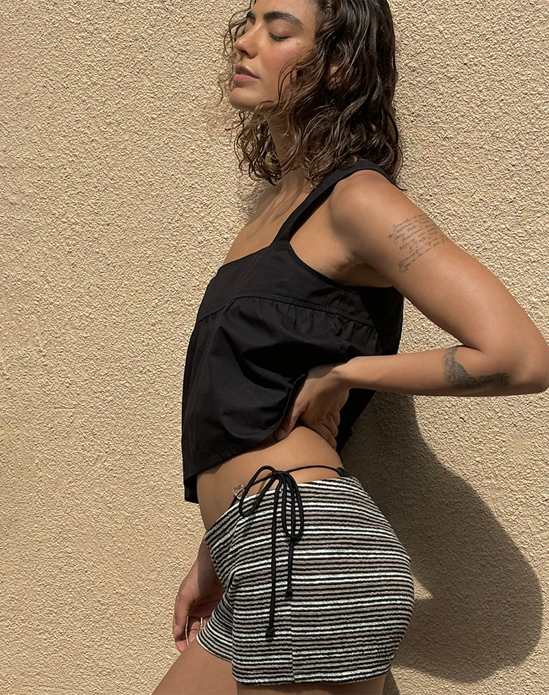 Top Karana Peplum de popelín negro