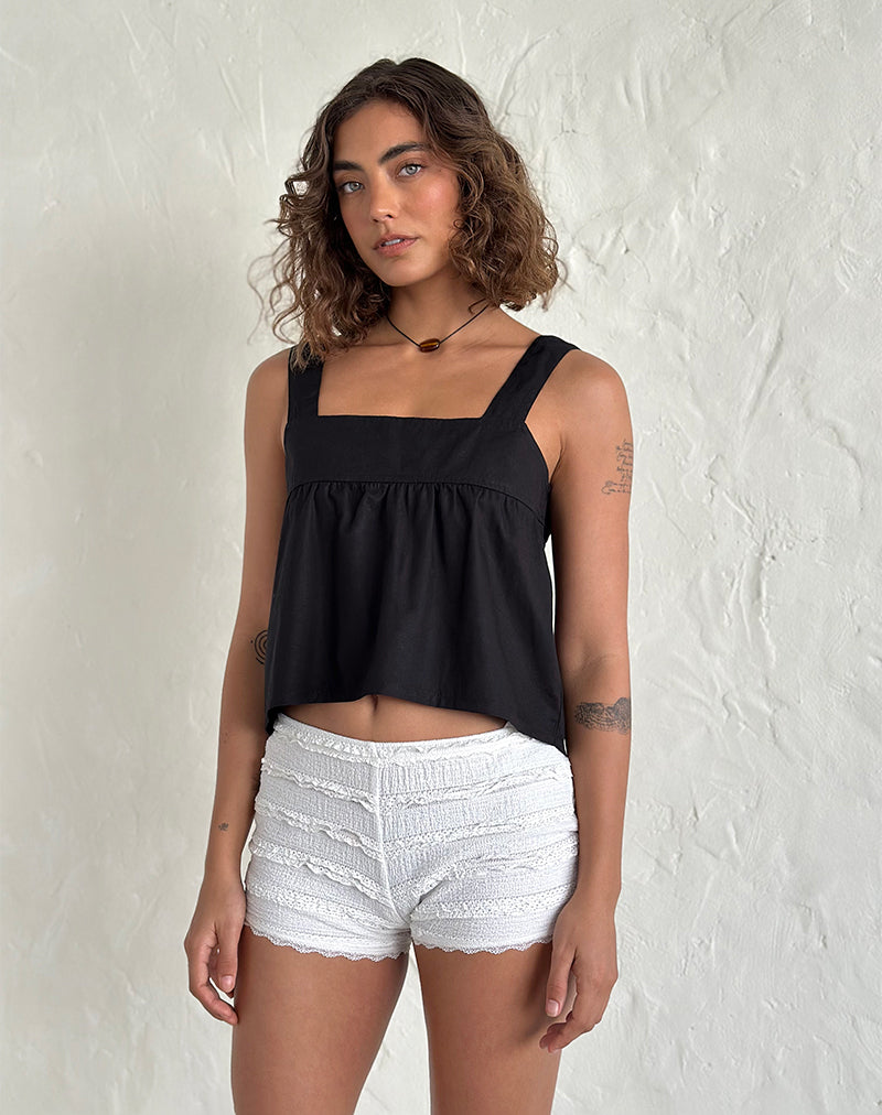 Top Karana Peplum de popelín negro