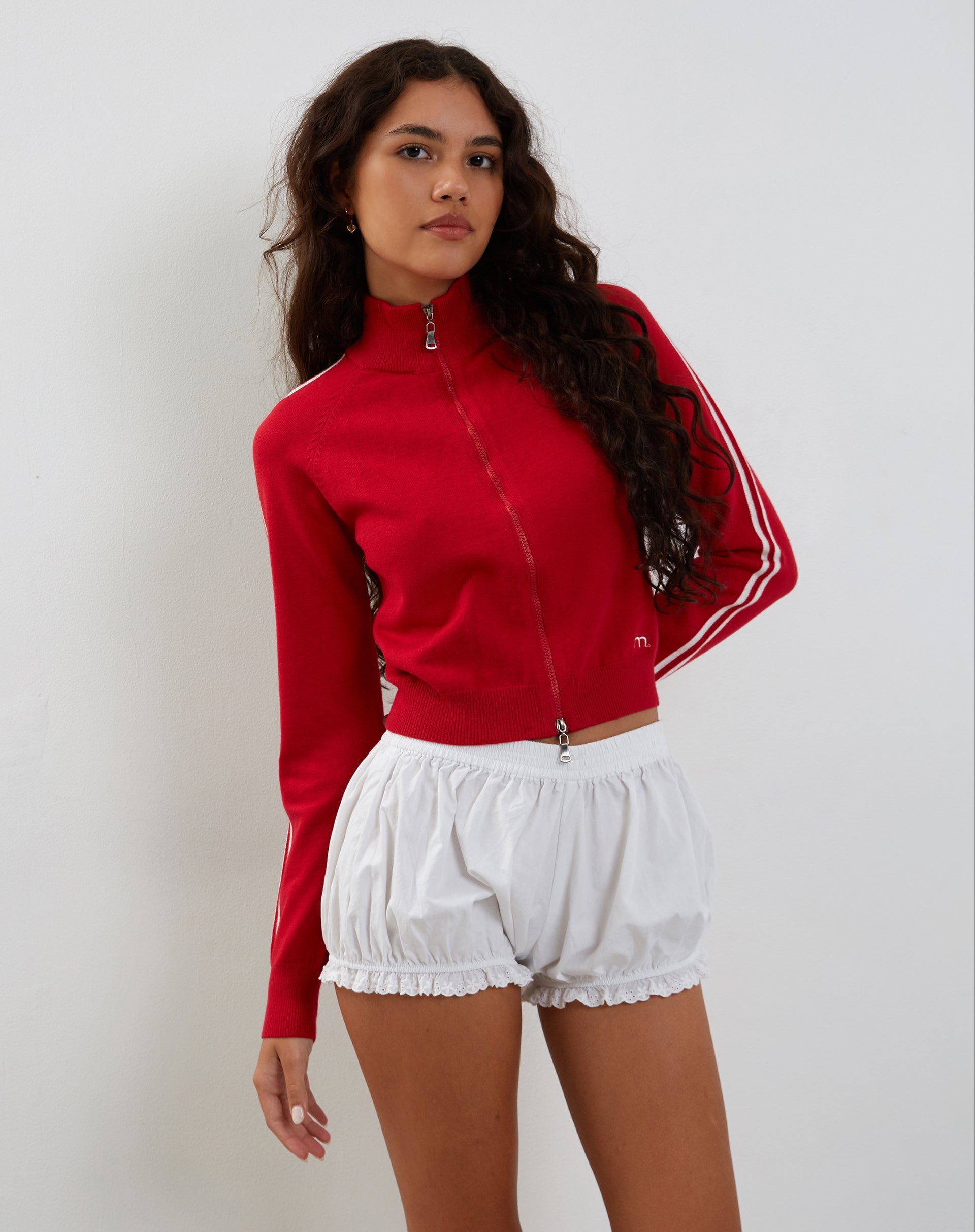 Imagen de la chaqueta Lennon Zip Up en rojo con rayas laterales blancas