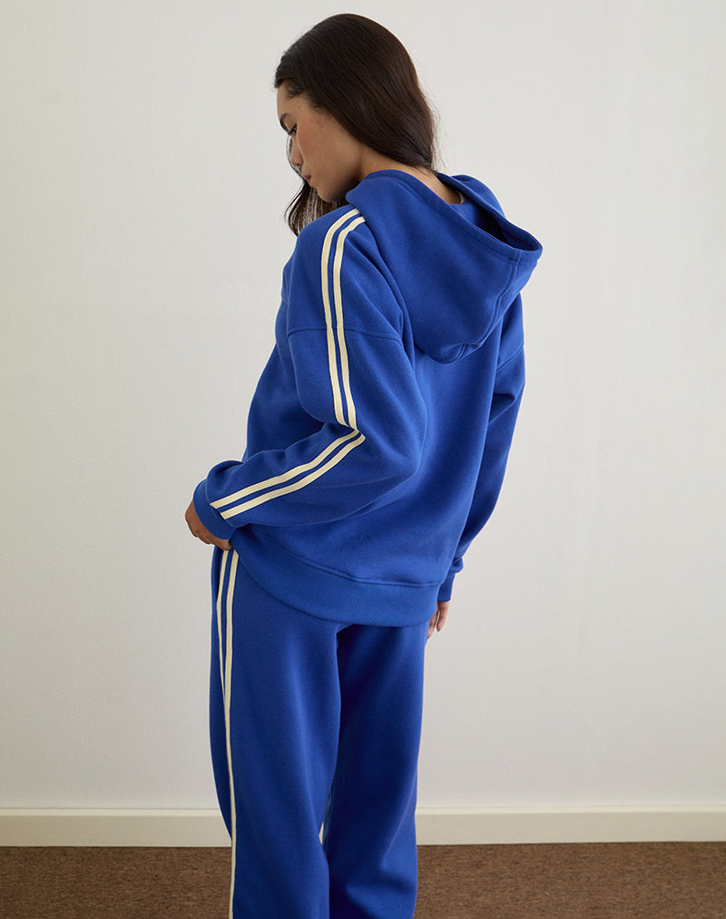 Imagen de la sudadera con capucha Lingwu en azul cobalto con ribetes en color suero de mantequilla