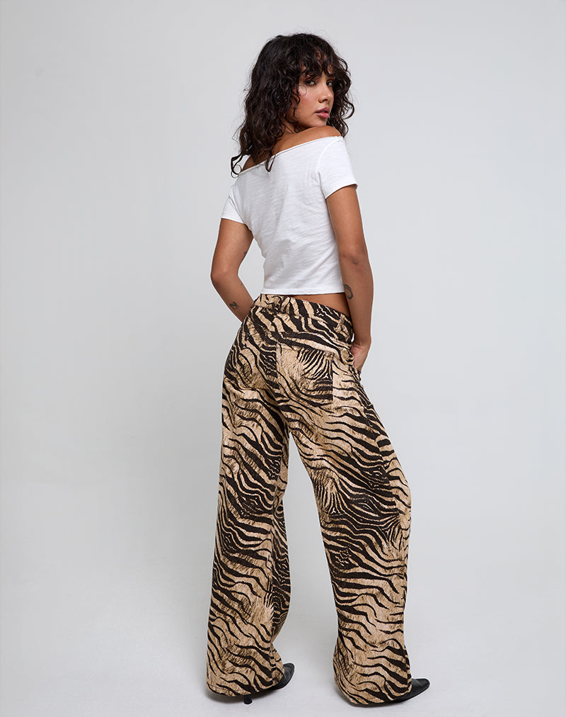 Image of Pantalones anchos de tiro bajo con estampado de animales salvajes