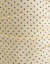 Crema con microestampado de lunares negro