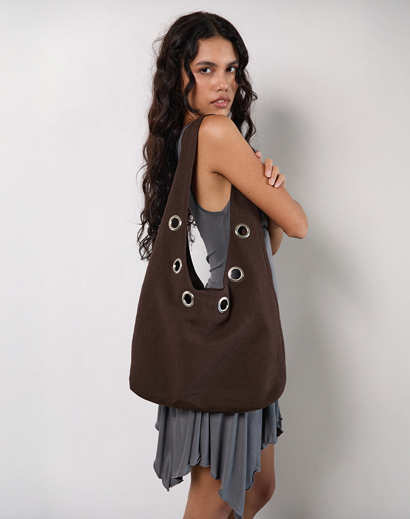 Bolso de hombro Oru en marrón con ojales