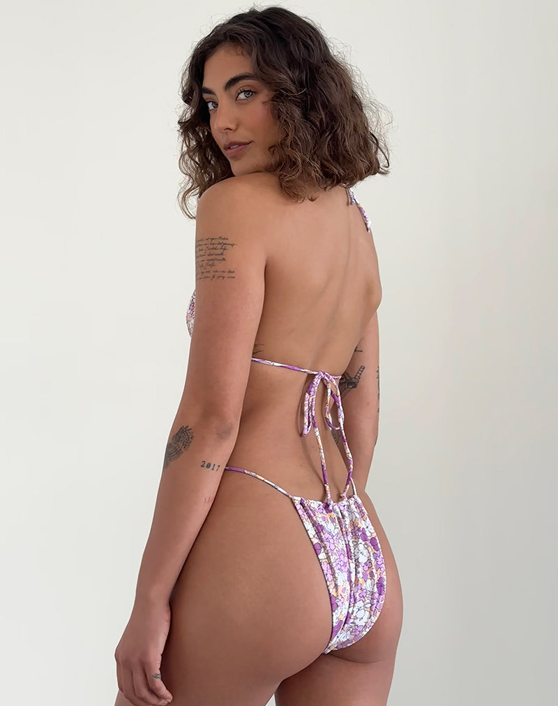 Imagen de la braguita de bikini Leyna en naranja y morado floral brillante
