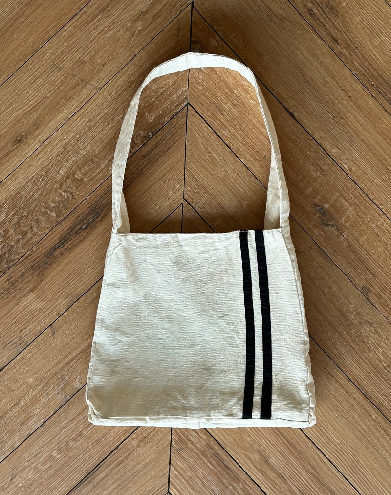Bolso de lona Pardi en crudo con raya negra