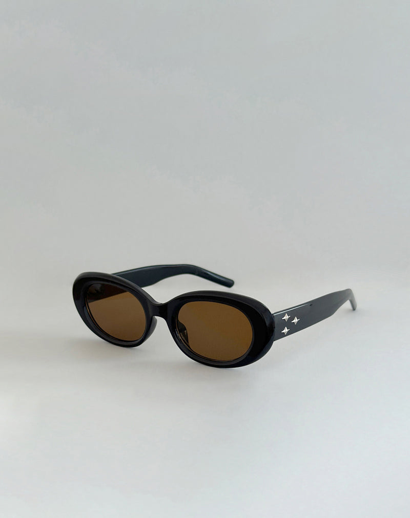 Imagen de las gafas de sol ovaladas Pido en negro con estrellas