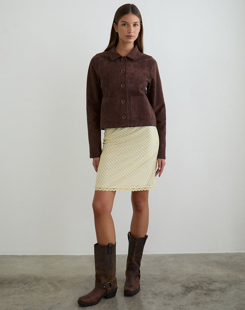 Imagen de la falda midi Rajuli en amarillo con lunares grises compactos.