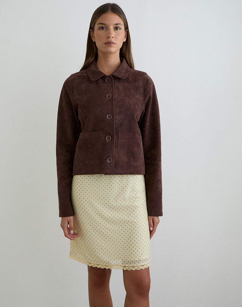 Imagen de la falda midi Rajuli en amarillo con lunares grises compactos.