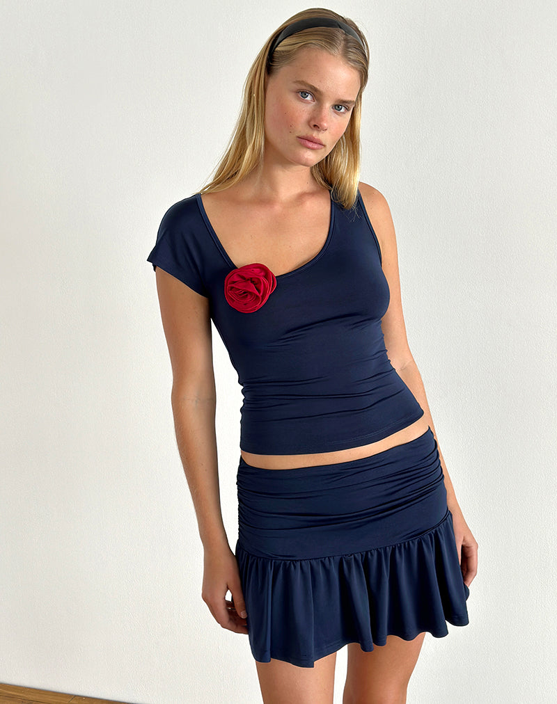 Top Rayla de licra azul marino con roseta roja