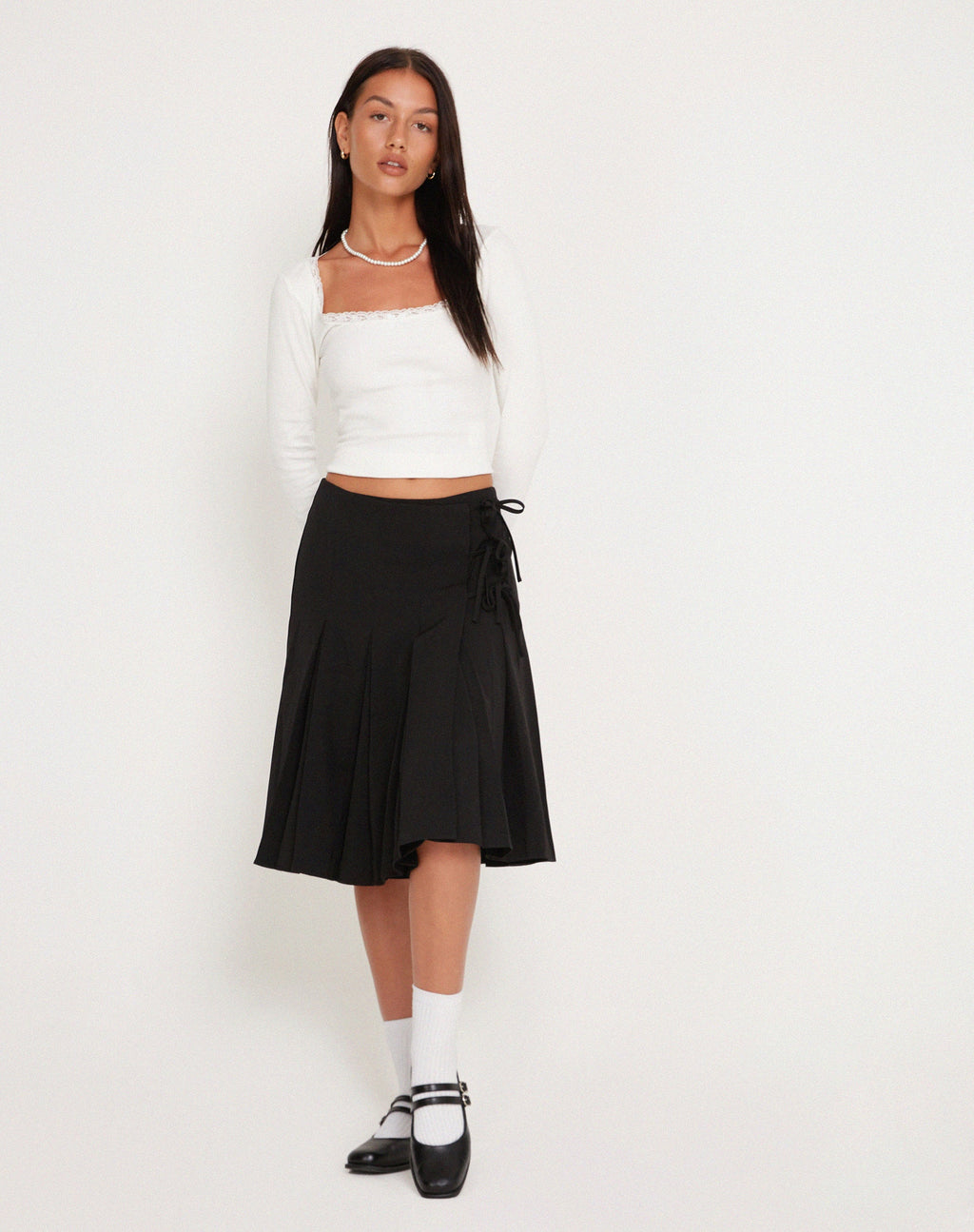 Madelyn Falda Midi Plisada en Negro
