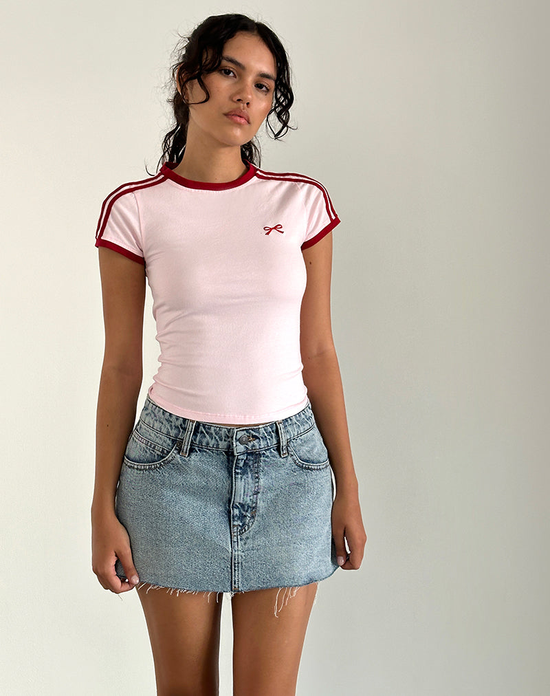 Image of Salda Top en rosa claro con ribete rojo Adrenaline y lazo bordado