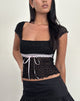 Imagen de Sherine Top de encaje negro con lazo rosa