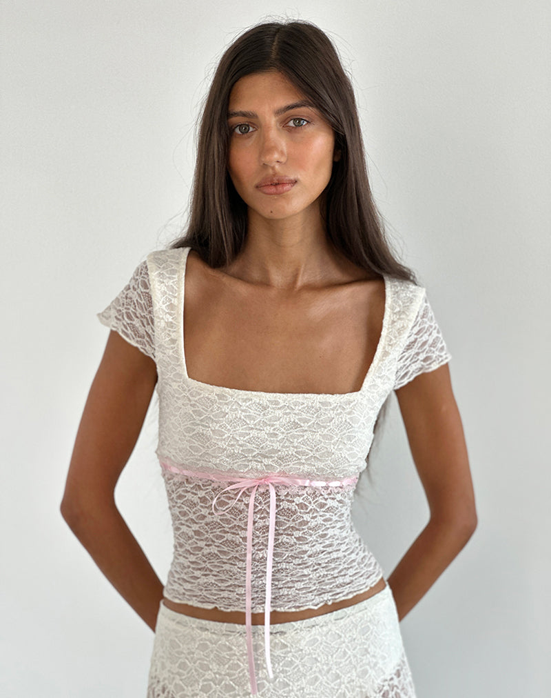 Top de encaje Sherine en crema con ribete rosa