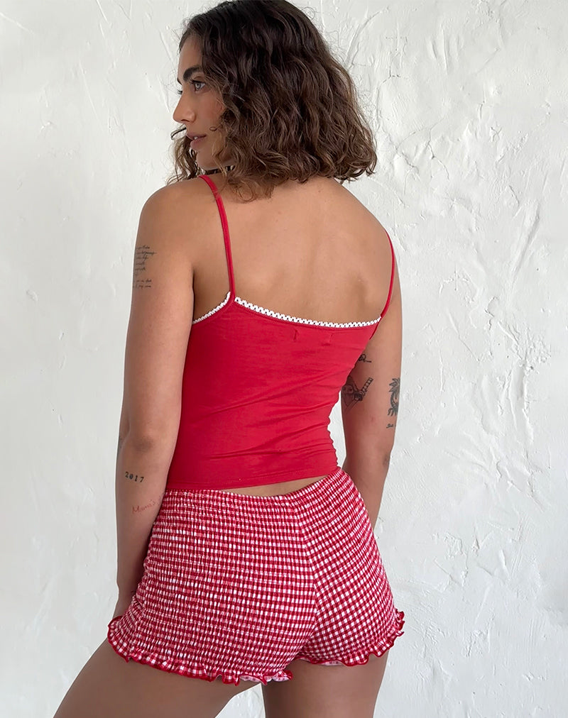Imagen de la camiseta Suna en rojo tango con ribete marfil