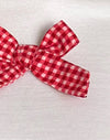 Blanco con lazo de guinga rojo