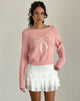 Imagen del jersey Tami de punto rosa con lazo blanco bordado