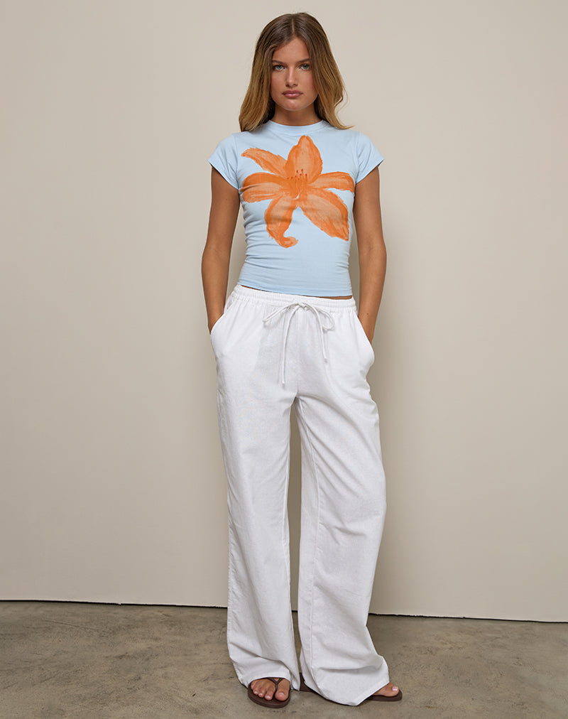 Imagen de Tiona Tee en azul con flor pintada en naranja