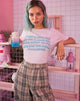 Image of Camiseta básica oversize en rosa suave con texto Almendra Leche Niña X Top Niña