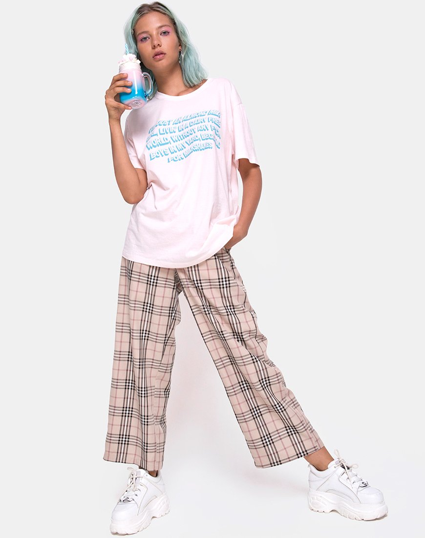 Image of Camiseta básica oversize en rosa suave con texto Almendra Leche Niña X Top Niña