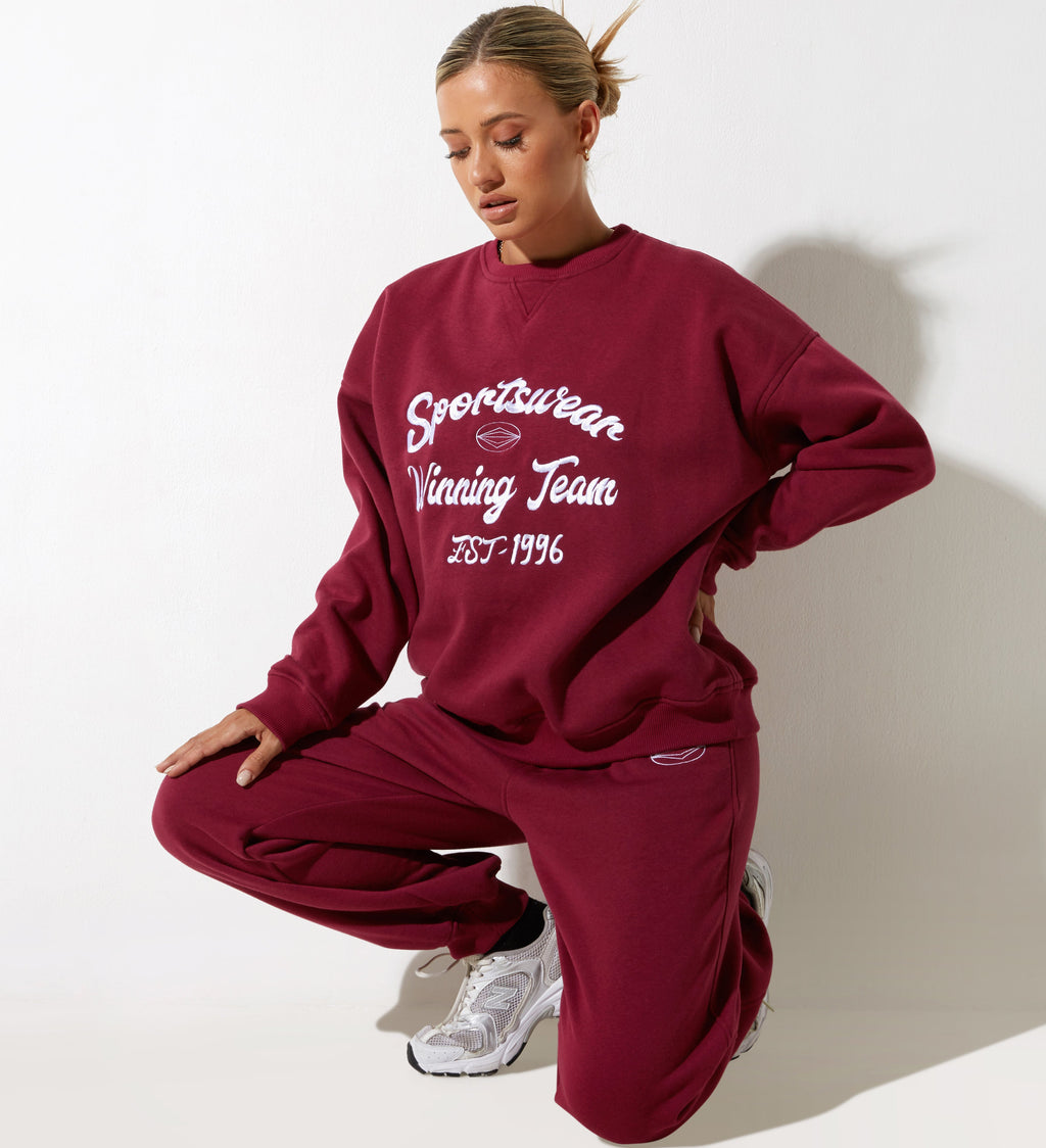 Sudadera Glan en burdeos con bordado "Winning Team