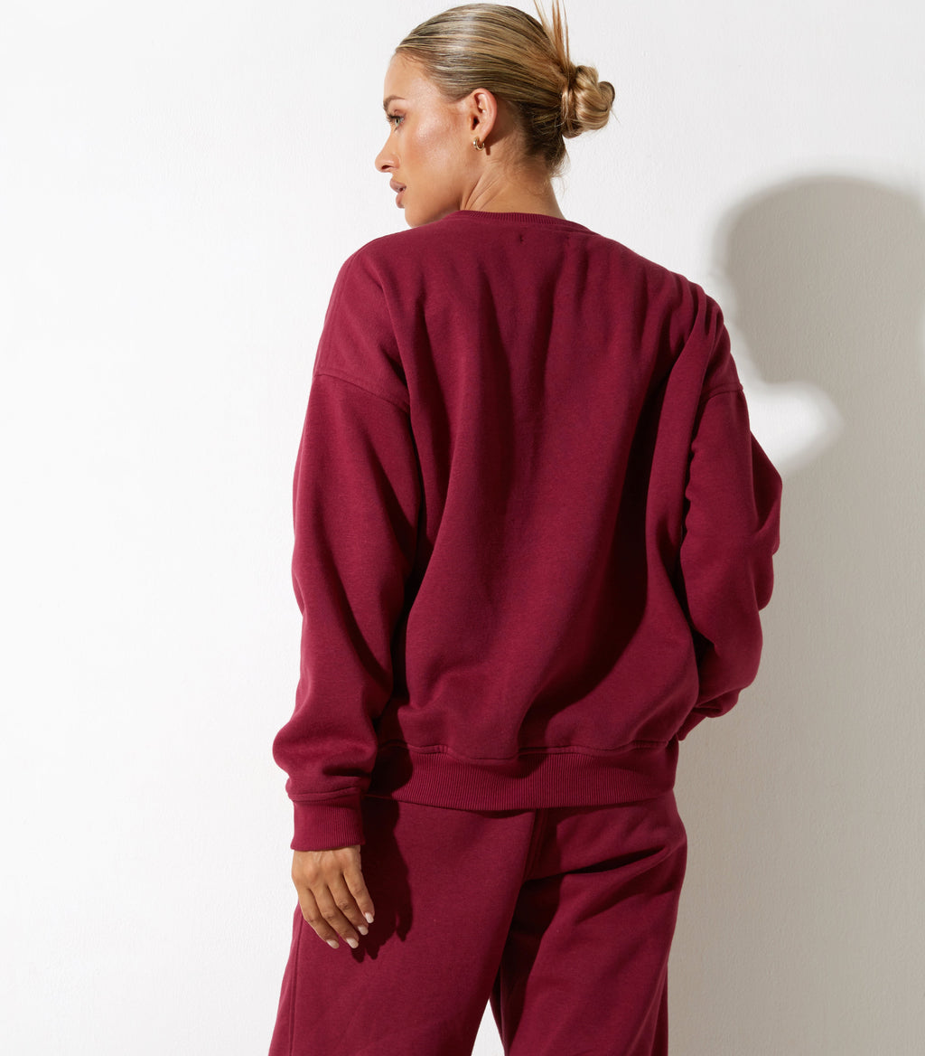 Sudadera Glan en burdeos con bordado "Winning Team