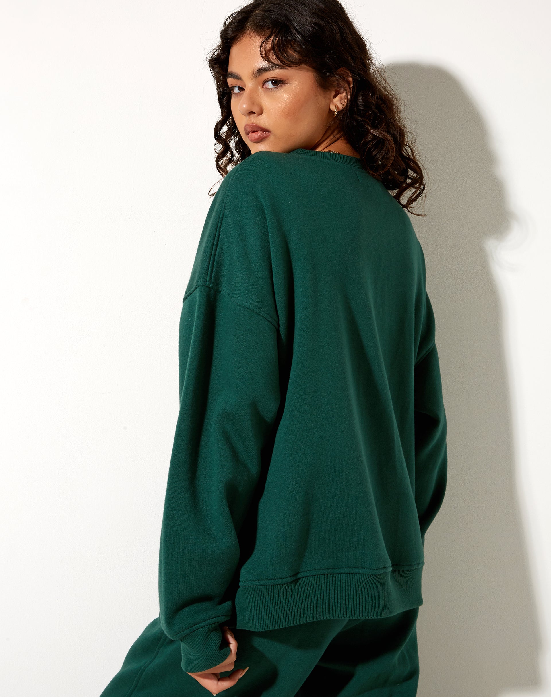 Imagen de la sudadera Glan en verde bosque con bordado Winning Team Mix