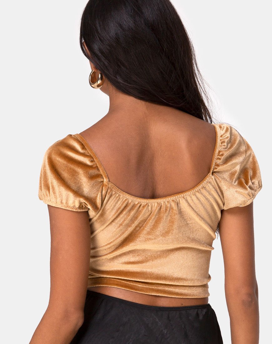 Top de terciopelo dorado