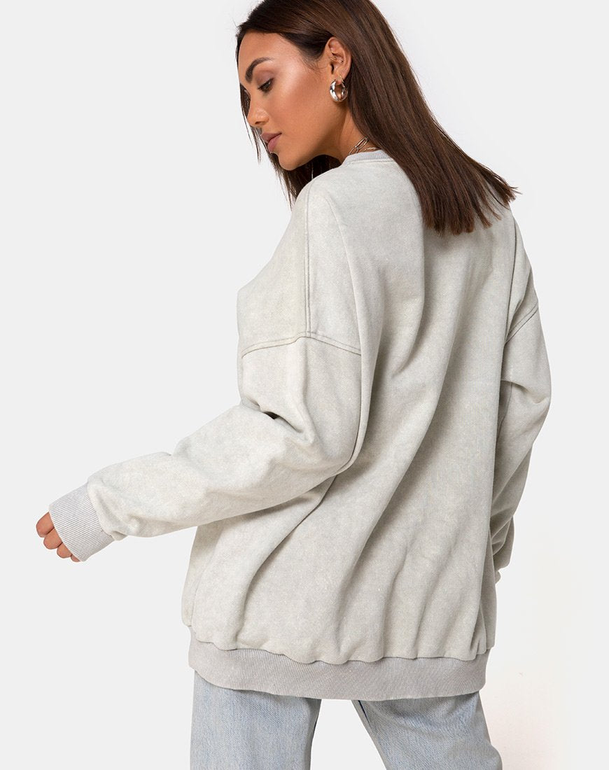 Imagen de sudadera Glo en crudo con mariposa bordada
