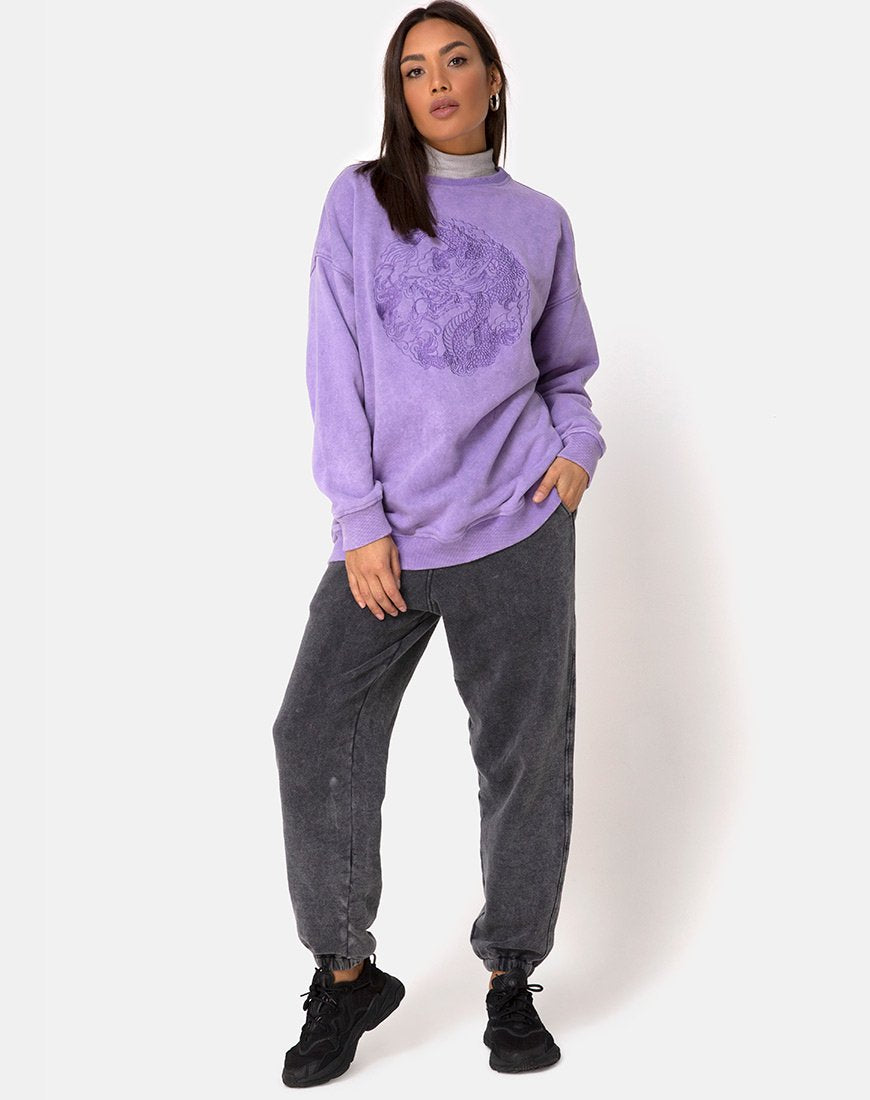 Imagen de sudadera Glo en lavado lila con bordado de dragón