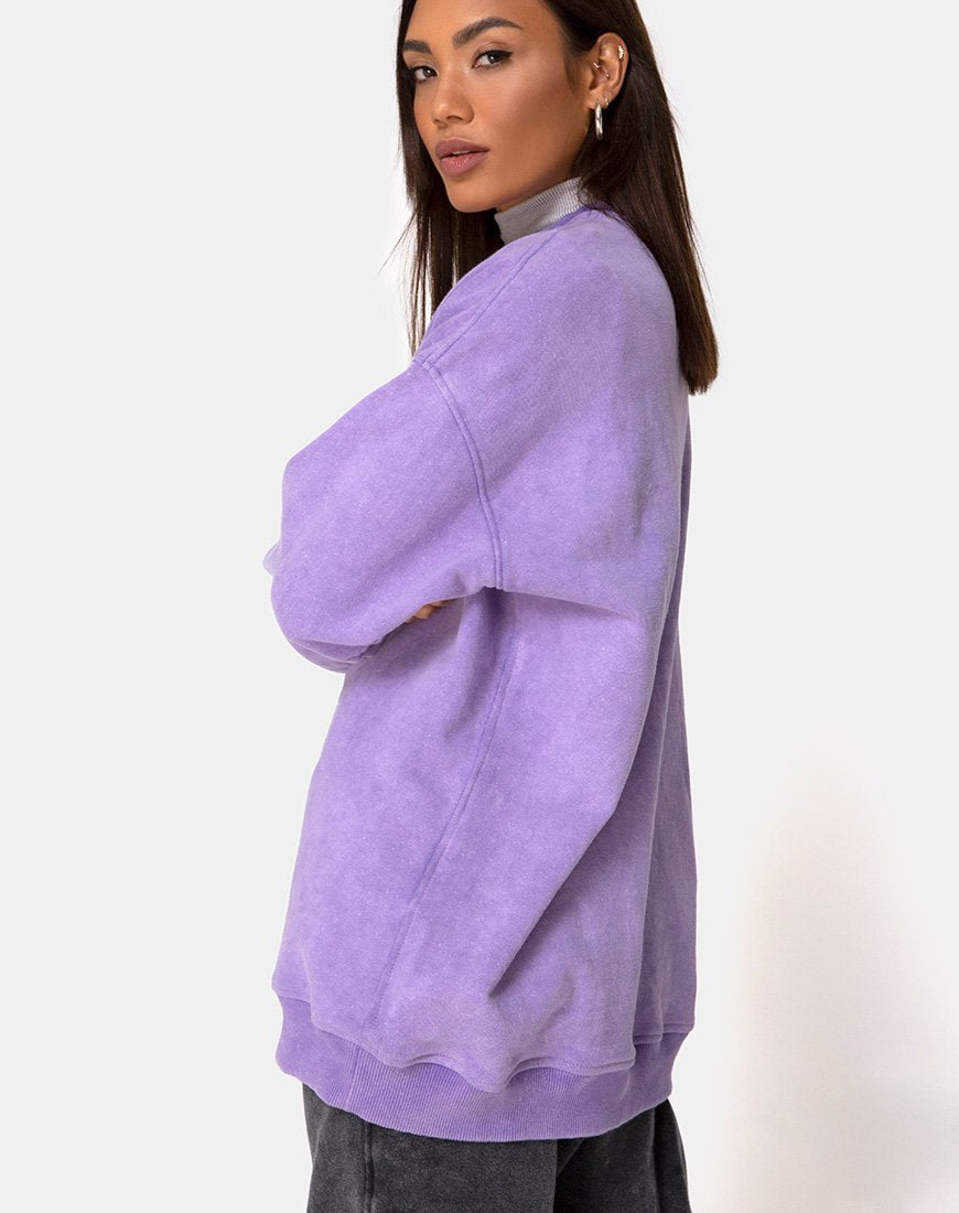 Imagen de sudadera Glo en lavado lila con bordado de dragón