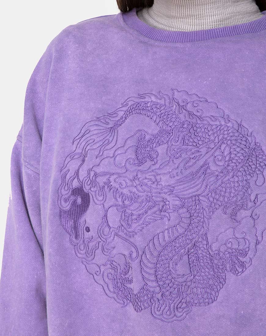 Imagen de sudadera Glo en lavado lila con bordado de dragón