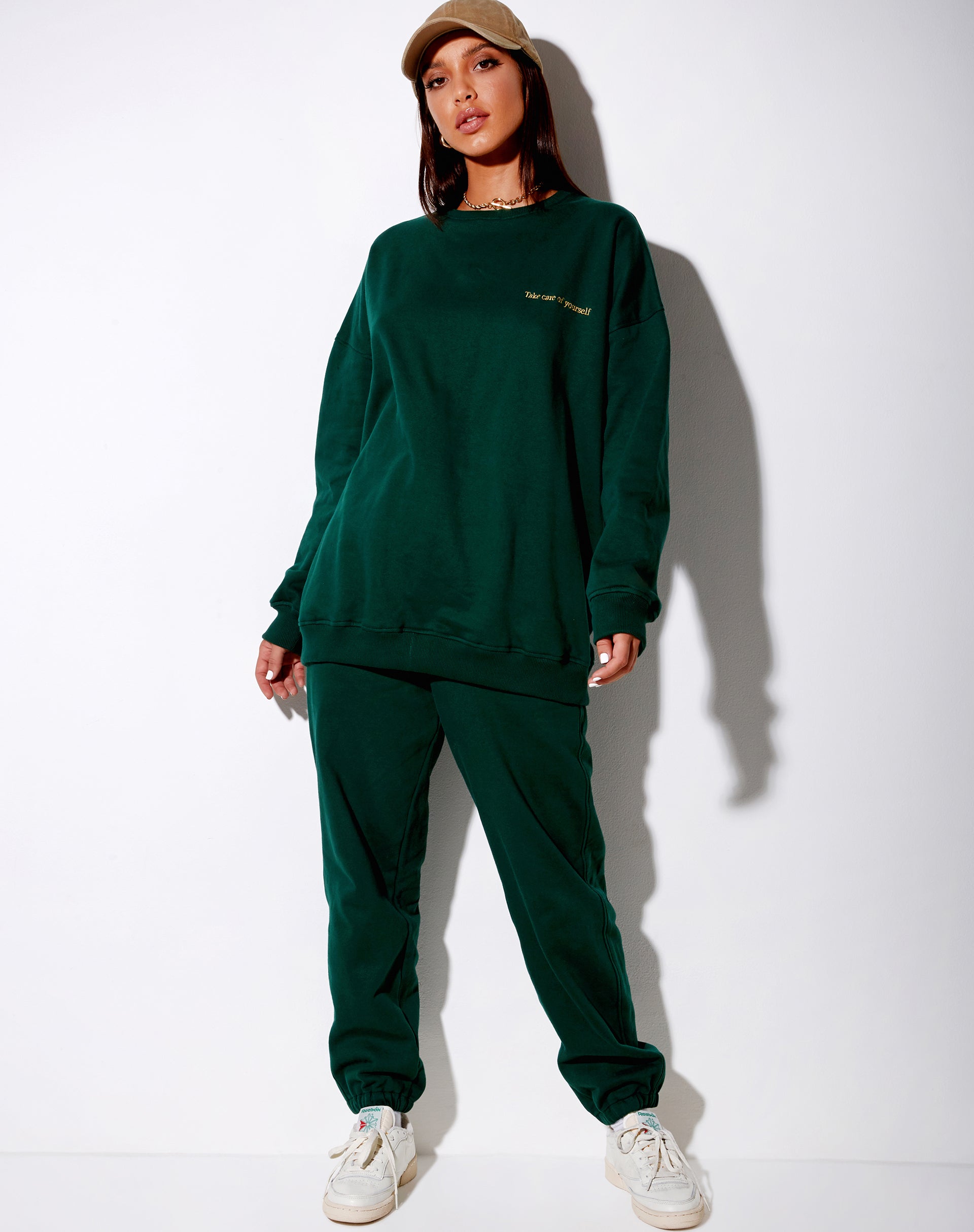 Imagen de sudadera Glo en verde botella con bordado Take Care Of Yourself