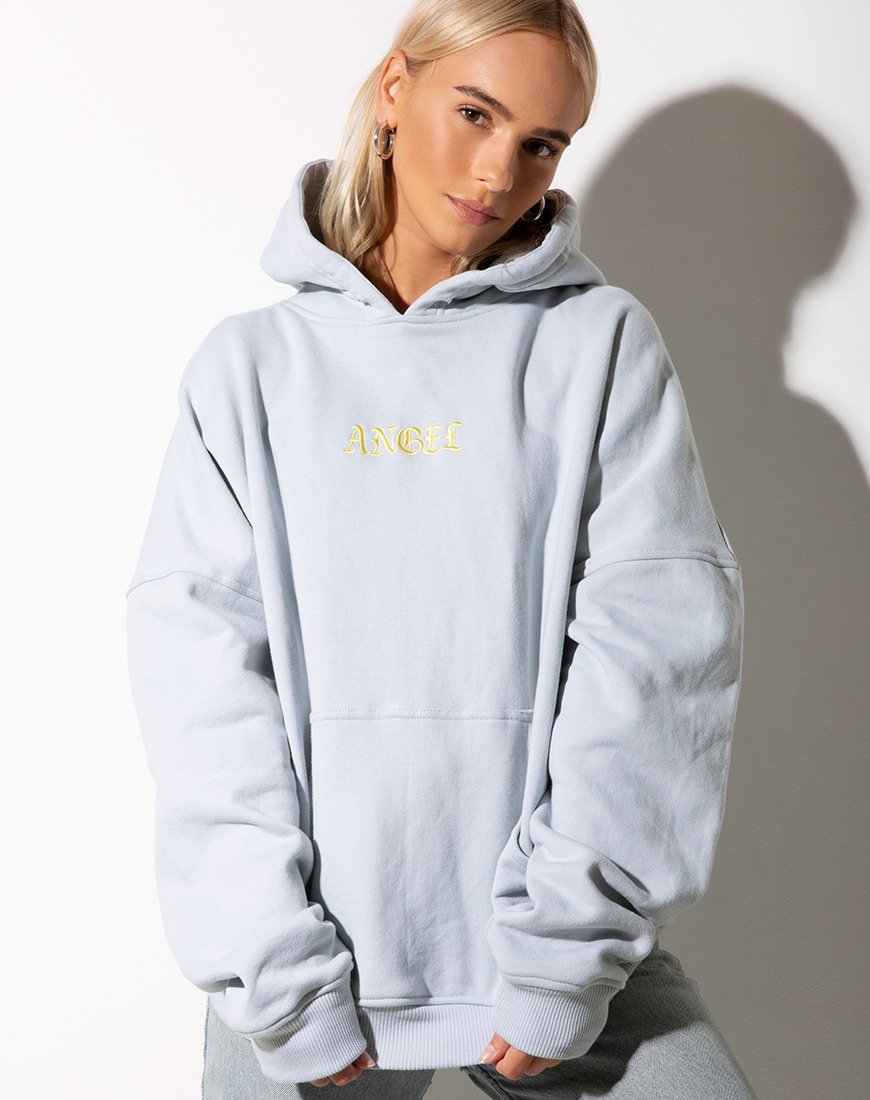 Image of Sudadera oversize con capucha azul bebé y bordado ángel limón
