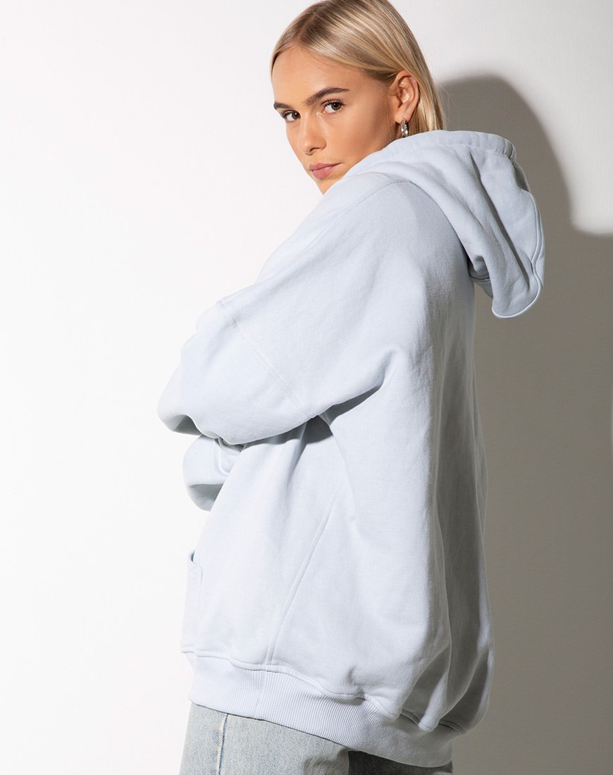 Image of Sudadera oversize con capucha azul bebé y bordado ángel limón