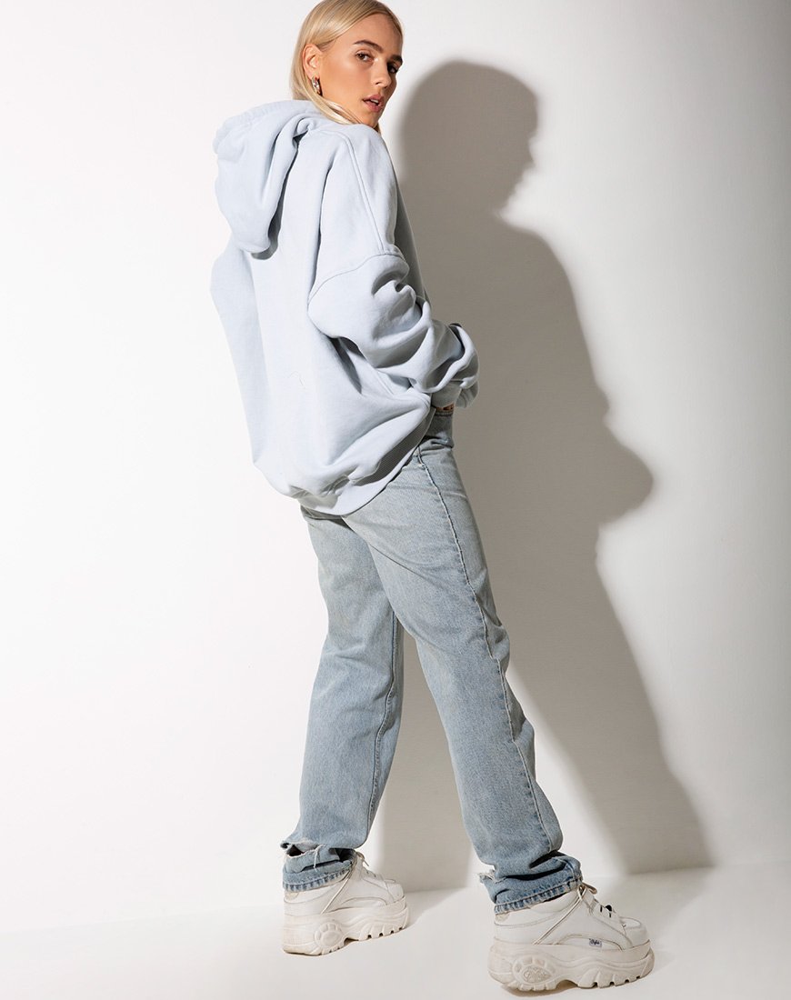 Image of Sudadera oversize con capucha azul bebé y bordado ángel limón