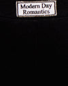 Negro Modern Day Romantics Label Embro