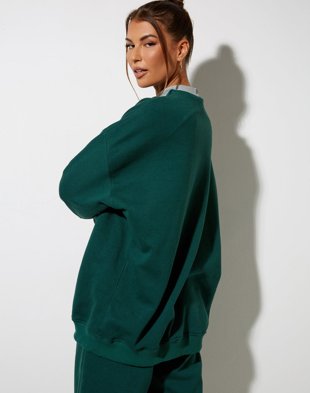 Sudadera Glo en verde botella con bordado "Angel" en blanco